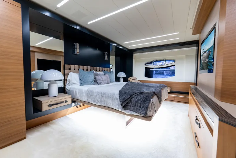  Yacht Photos Pics Luxurious bedroom interior of 2012 Pershing 92 yacht with modern design and elegant furnishings.