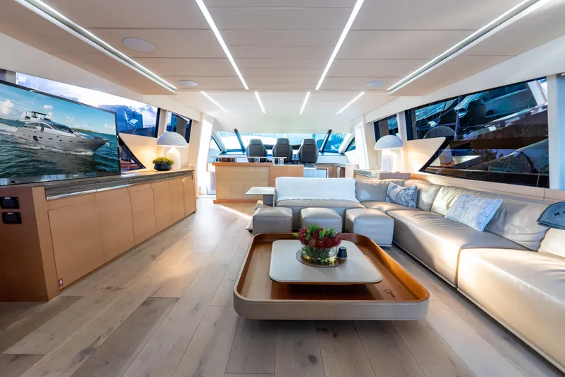  Yacht Photos Pics Luxurious interior of a 2012 Pershing 92 yacht with modern furnishings and large windows.