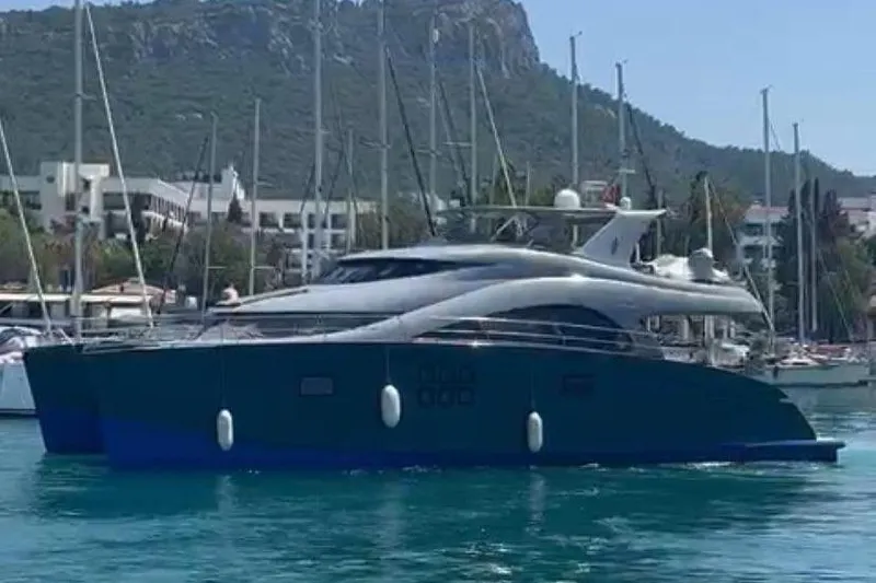  Yacht Photos Pics Luxury Sunreef 60 yacht from 2012 docked in a scenic marina.