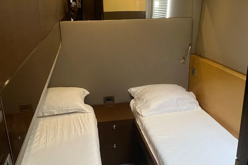  Yacht Photos Pics Twin cabin beds in a 2012 Sunreef 60 yacht, featuring modern design and cozy bedding.