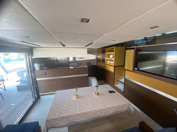  Yacht Photos Pics Luxurious interior of a 2012 Sunreef 60 yacht with modern furnishings and elegant dining area.