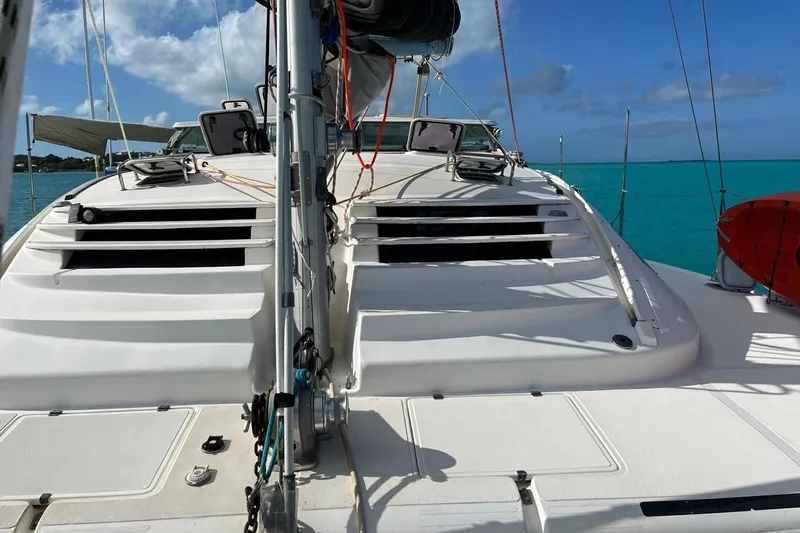 Alleycat Yacht Photos Pics 2004 Island Spirit 400 catamaran on turquoise water, clear sky, and deck view.