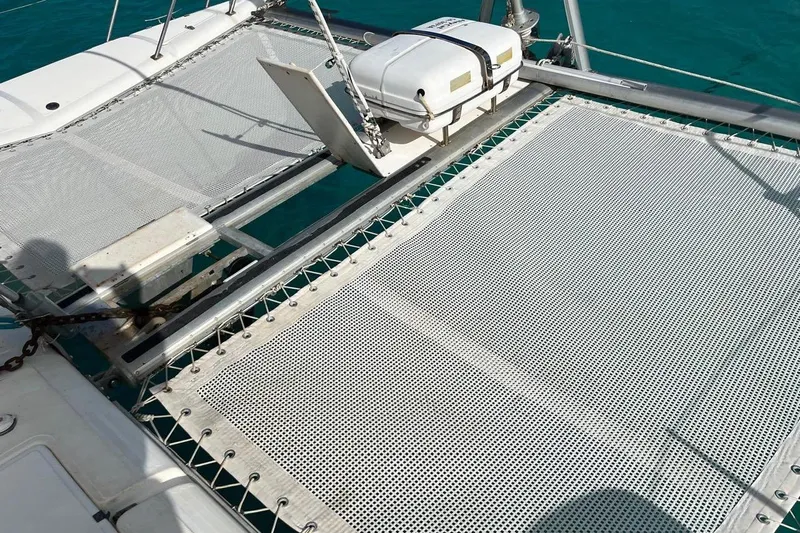 Alleycat Yacht Photos Pics Trampoline deck of 2004 Island Spirit 400 catamaran on turquoise water.