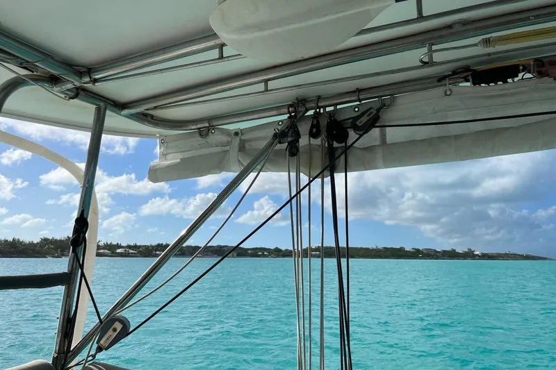 Alleycat Yacht Photos Pics Sailing view from 2004 Island Spirit 400 catamaran, turquoise waters, and clear sky.