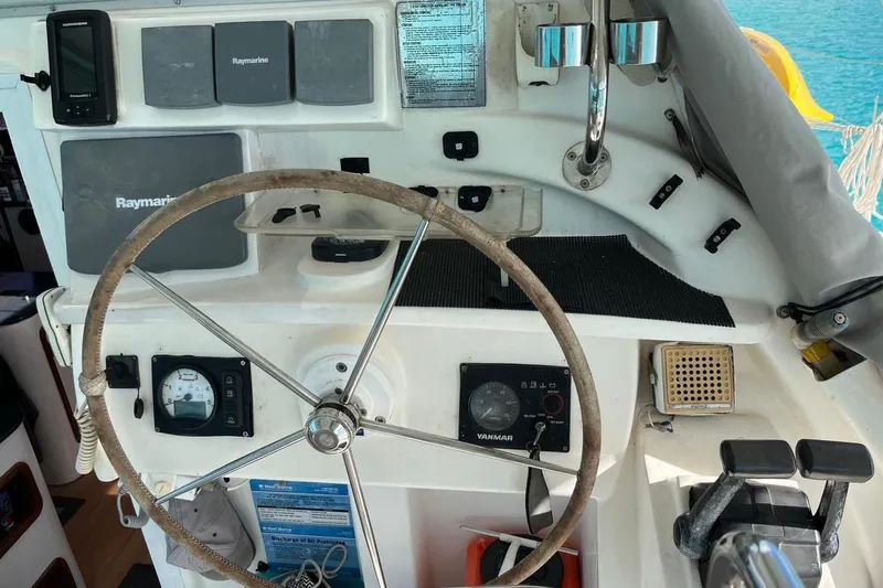 Alleycat Yacht Photos Pics Steering wheel and controls of a 2004 Island Spirit 400 sailboat cockpit.