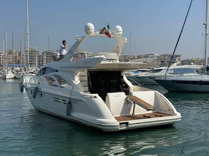 Azimut Benetti Fly 50 Yacht Photos Pics 2006 Azimut 50 yacht docked in a marina, with a clear blue sky.