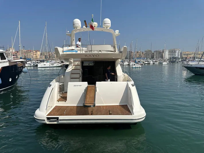 Azimut Benetti Fly 50 Yacht Photos Pics Azimut 50 yacht from 2006 docked in a marina, surrounded by other boats.