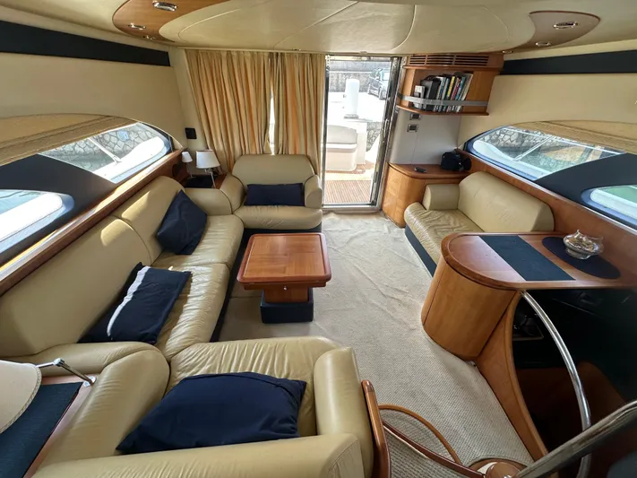 Azimut Benetti Fly 50 Yacht Photos Pics Luxurious interior of a 2006 Azimut 50 yacht with beige leather seating and wooden accents.
