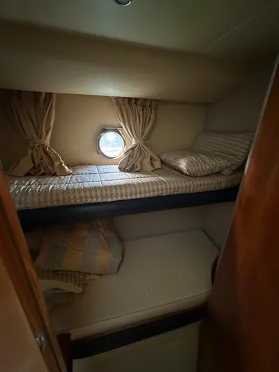 Azimut Benetti Fly 50 Yacht Photos Pics Cozy cabin interior of 2006 Azimut 50 yacht with bunk beds and porthole.