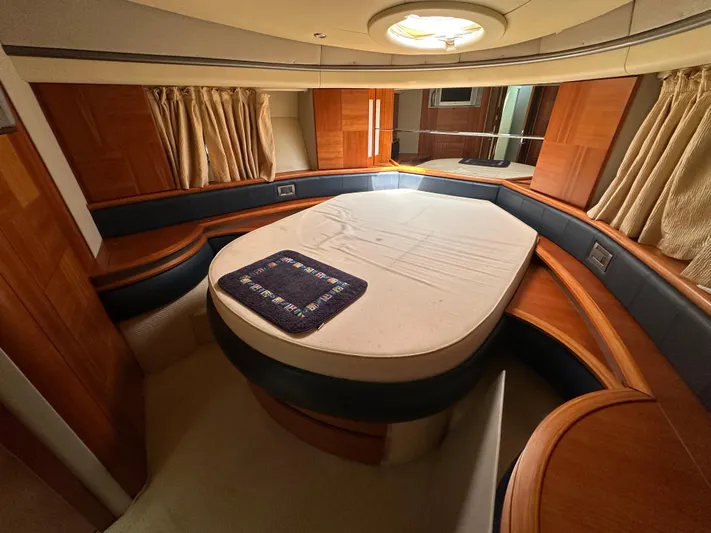 Azimut Benetti Fly 50 Yacht Photos Pics Luxurious cabin interior of a 2006 Azimut 50 yacht with elegant wood finishes.