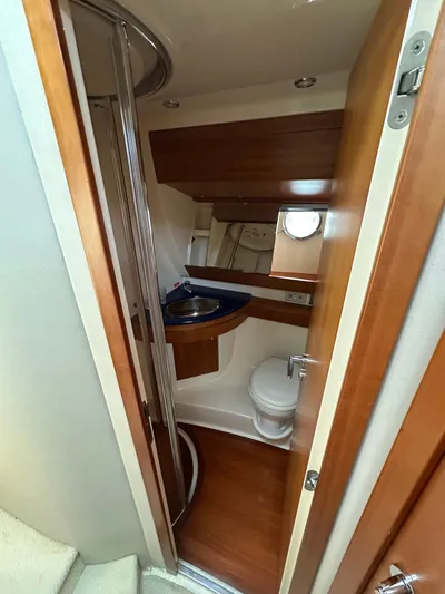 Azimut Benetti Fly 50 Yacht Photos Pics 2006 Azimut 50 yacht bathroom with wooden accents and compact design.