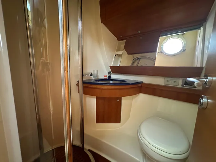 Azimut Benetti Fly 50 Yacht Photos Pics Bathroom interior of 2006 Azimut 50 yacht, featuring shower, sink, and toilet.