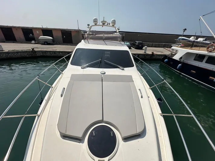 Azimut Benetti Fly 50 Yacht Photos Pics 2006 Azimut 50 yacht docked in marina, top view of deck and cabin.