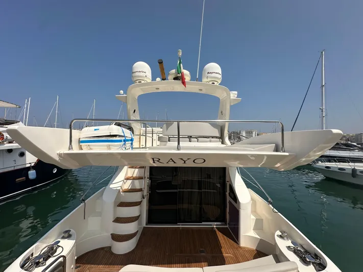 Azimut Benetti Fly 50 Yacht Photos Pics 2006 Azimut 50 yacht docked in marina, rear view with open deck and stairs.