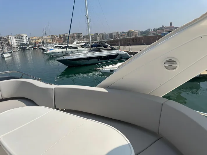 Azimut Benetti Fly 50 Yacht Photos Pics Luxury yacht Azimut 50, 2006 model, docked in a marina with other boats.