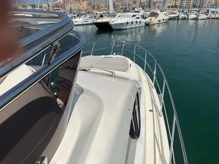 Azimut Benetti Fly 50 Yacht Photos Pics 2006 Azimut 50 yacht docked in a marina, surrounded by other boats.