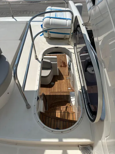 Azimut Benetti Fly 50 Yacht Photos Pics 2006 Azimut 50 yacht interior with wooden stairs and seating area.