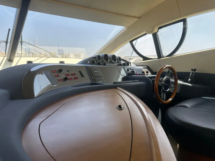 Azimut Benetti Fly 50 Yacht Photos Pics Interior view of 2006 Azimut 50 yacht cockpit with steering wheel and control panel.