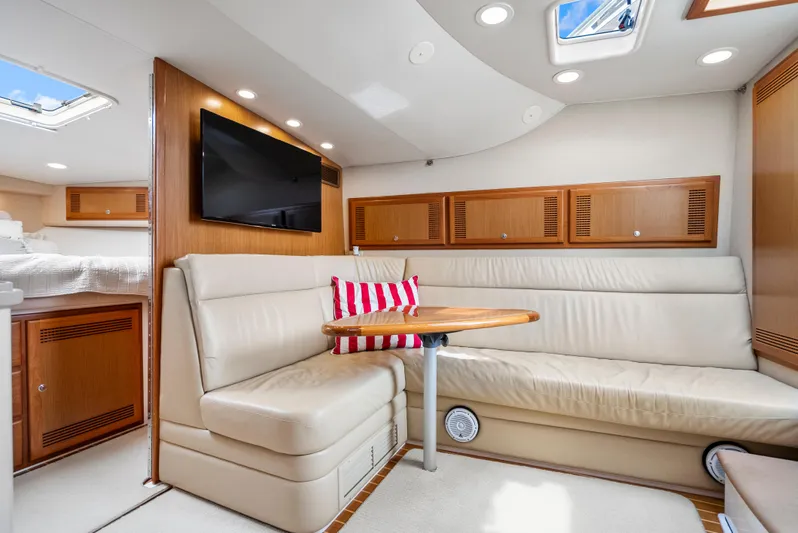 King's Ransom Yacht Photos Pics Luxurious interior of 2004 Cabo 40 Express yacht with leather seating and modern amenities.