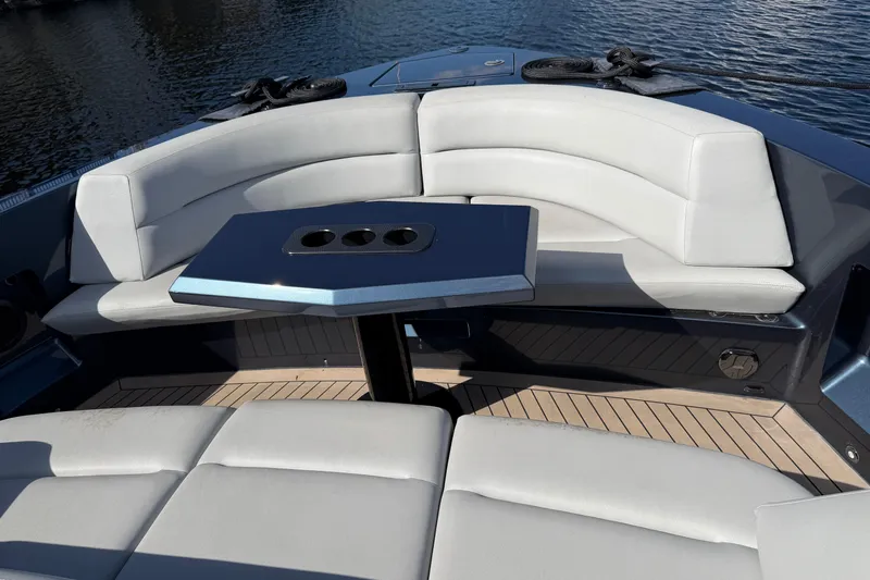  Yacht Photos Pics Luxurious seating area on 2022 Vanquish VQ45 yacht with sleek table design.