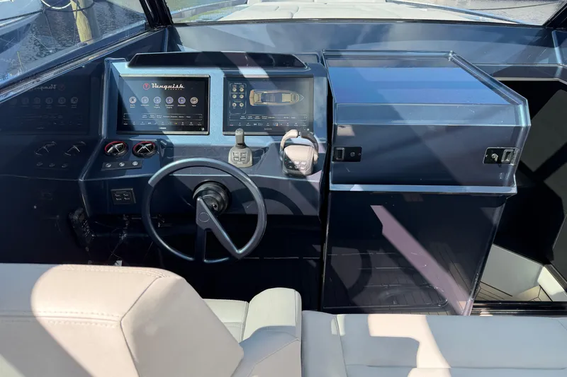  Yacht Photos Pics Cockpit of 2022 Vanquish VQ45 yacht with modern controls and steering wheel.