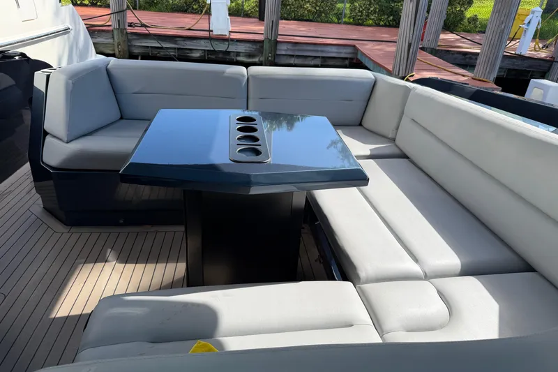  Yacht Photos Pics Luxurious seating area on 2022 Vanquish VQ45 yacht with sleek table design.
