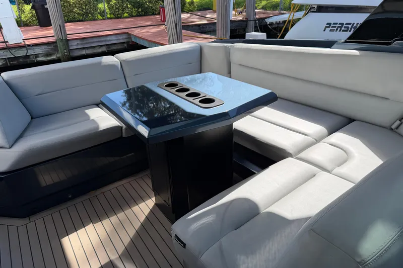  Yacht Photos Pics Luxurious seating area on 2022 Vanquish VQ45 yacht with sleek table design.