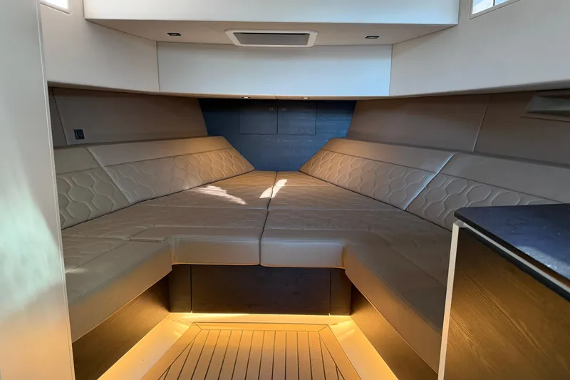  Yacht Photos Pics Luxurious interior cabin of 2022 Vanquish VQ45 yacht with elegant seating.