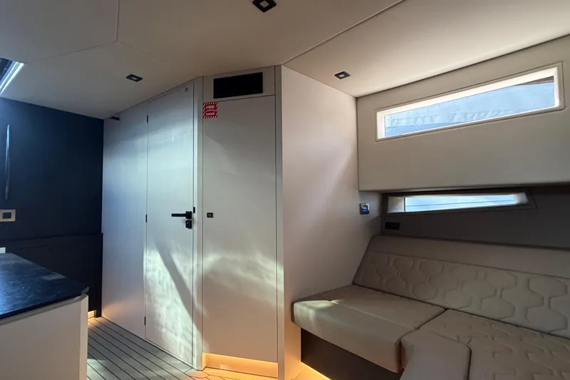  Yacht Photos Pics Modern interior of 2022 Vanquish VQ45 yacht with sleek design and comfortable seating.