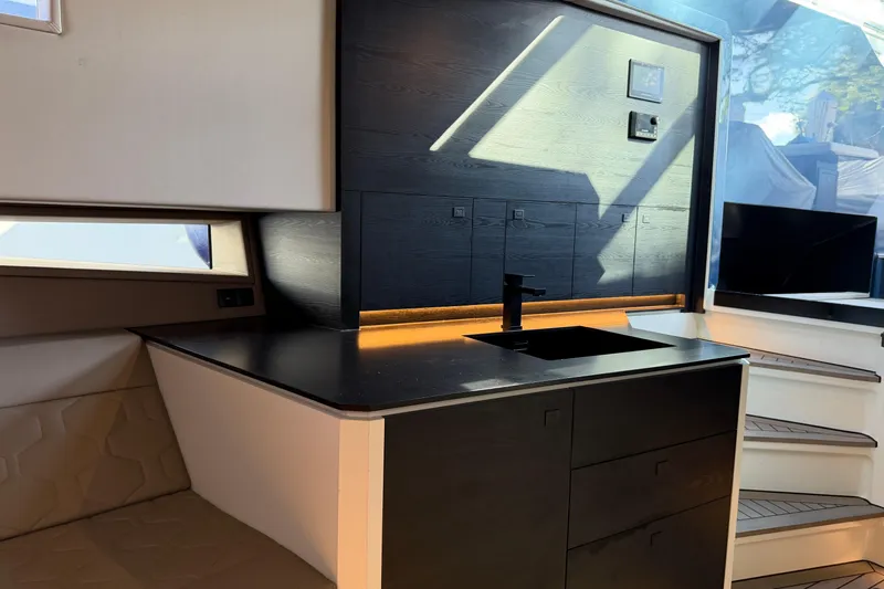  Yacht Photos Pics Modern interior of 2022 Vanquish VQ45 yacht with sleek kitchen design.