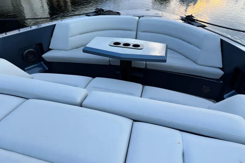  Yacht Photos Pics Luxurious seating area on 2022 Vanquish VQ45 yacht with sleek design and cup holders.