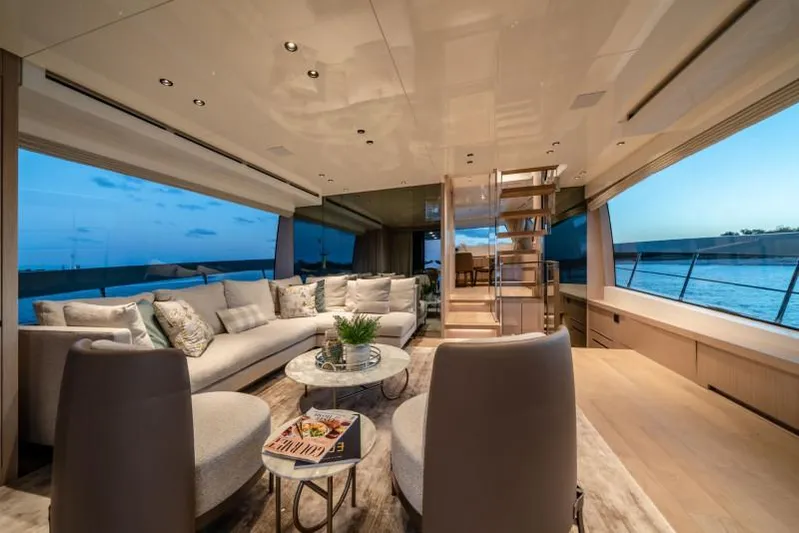  Yacht Photos Pics Luxurious interior of 2021 Sanlorenzo SX76 yacht with elegant seating and ocean view.