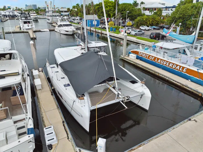 Neptune's Waters Yacht Photos Pics 2019 Lagoon 42 catamaran docked in marina.