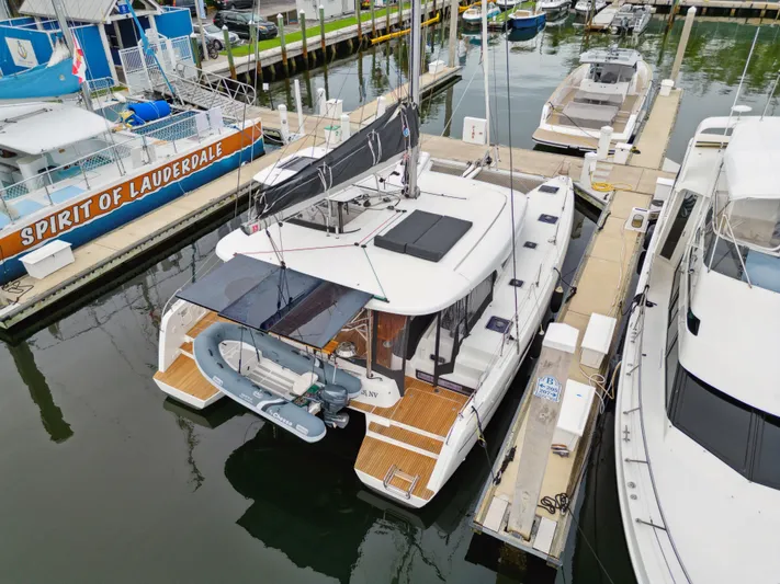 Neptune's Waters Yacht Photos Pics 2019 Lagoon 42 catamaran docked at marina.
