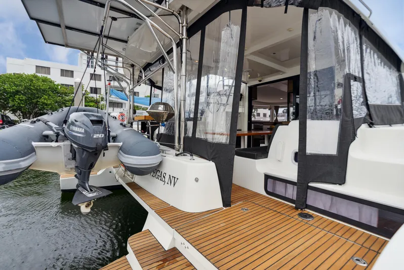 Neptune's Waters Yacht Photos Pics 2019 Lagoon 42 catamaran with outboard motor and teak deck.