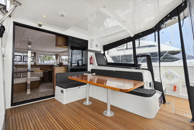 Neptune's Waters Yacht Photos Pics Interior of a 2019 Lagoon 42 yacht with wooden flooring.