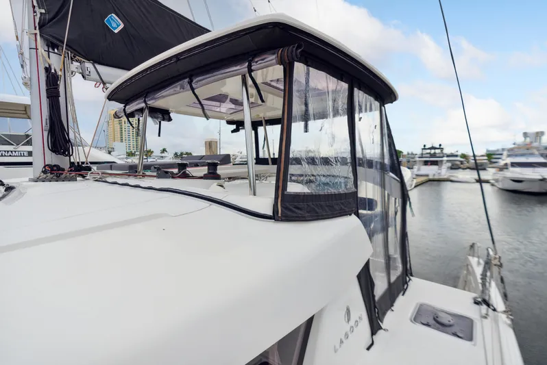 Neptune's Waters Yacht Photos Pics 2019 Lagoon 42 catamaran docked with sail cover.