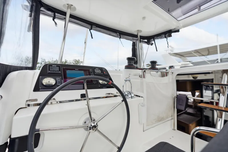 Neptune's Waters Yacht Photos Pics Interior view of Lagoon 42 yacht, 2019 model, featuring helm station.