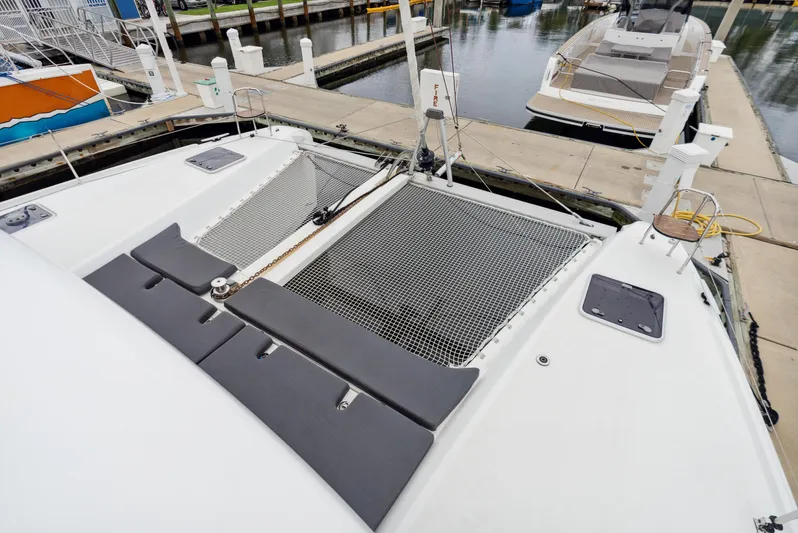 Neptune's Waters Yacht Photos Pics 2019 Lagoon 42 catamaran docked at marina.