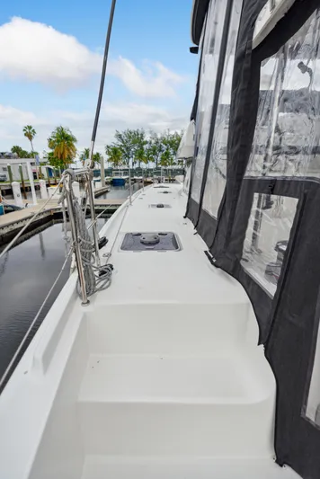 Neptune's Waters Yacht Photos Pics Lagoon 42 catamaran, 2019 model, docked in calm waters.