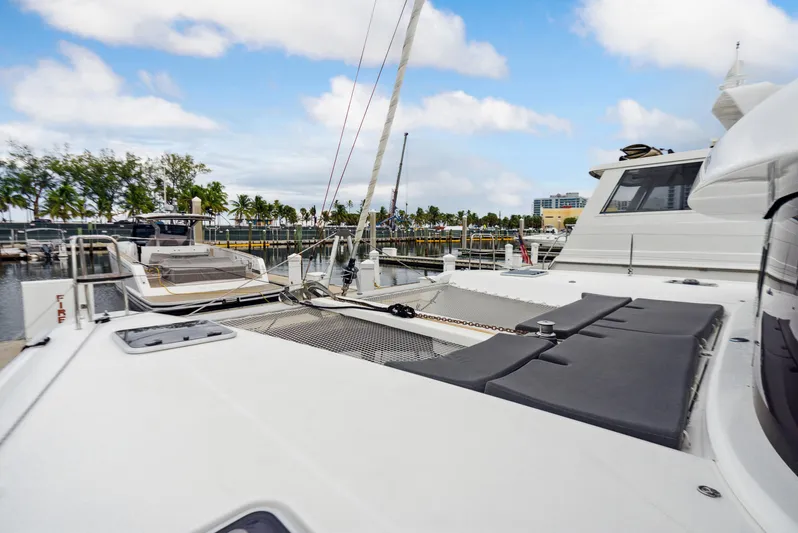 Neptune's Waters Yacht Photos Pics 2019 Lagoon 42 catamaran docked on a sunny day.