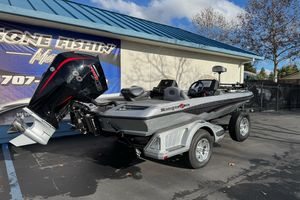 2026 Ranger Z518 Cup-Equipped boat with powerful engine, parked outdoors.
