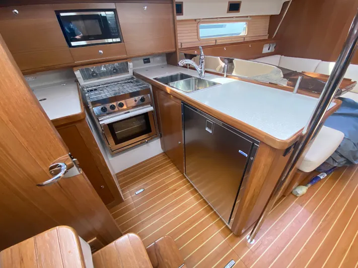 Catalina 425 In Stock Yacht Photos Pics Modern kitchen in 2024 Catalina 425 yacht with wood finish, stainless appliances, and sleek design.