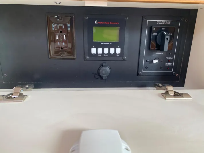 Catalina 425 In Stock Yacht Photos Pics Control panel of a 2024 Catalina 425 yacht with digital display and switches.