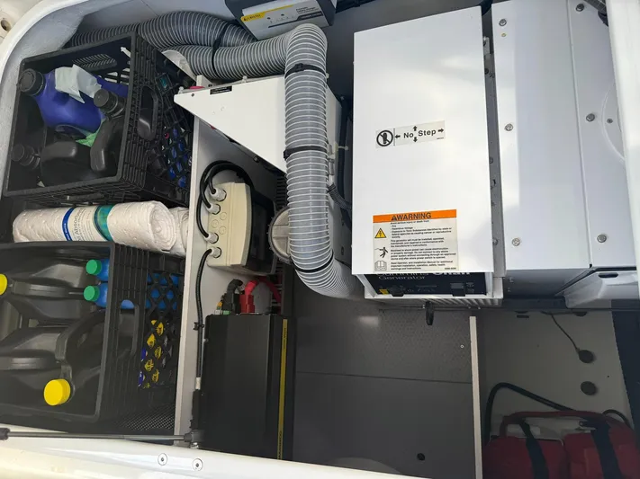 Wanderer Yacht Photos Pics Engine room of 2016 Beneteau Swift Trawler 44 with equipment and supplies.