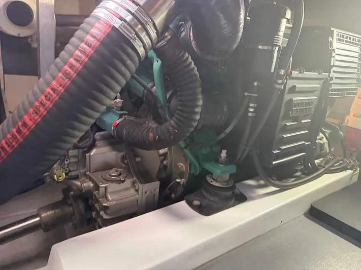 Wanderer Yacht Photos Pics Engine compartment of a 2016 Beneteau Swift Trawler 44, showcasing mechanical components and hoses.