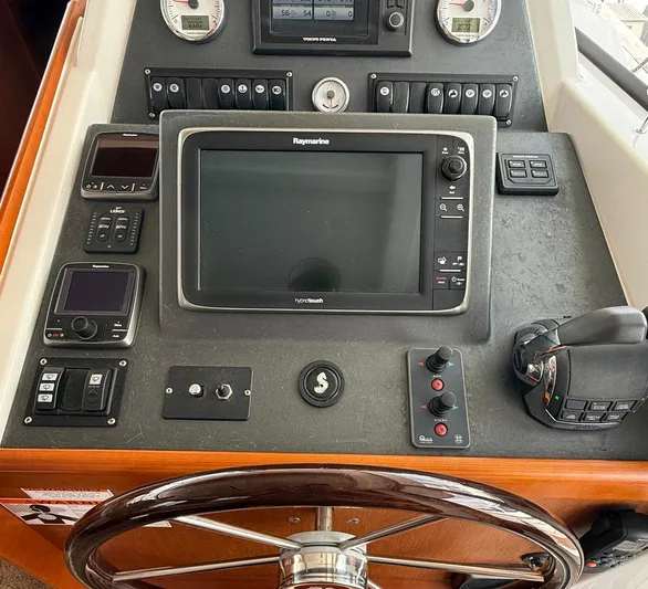 Wanderer Yacht Photos Pics Control panel of a 2016 Beneteau Swift Trawler 44 with navigation equipment.
