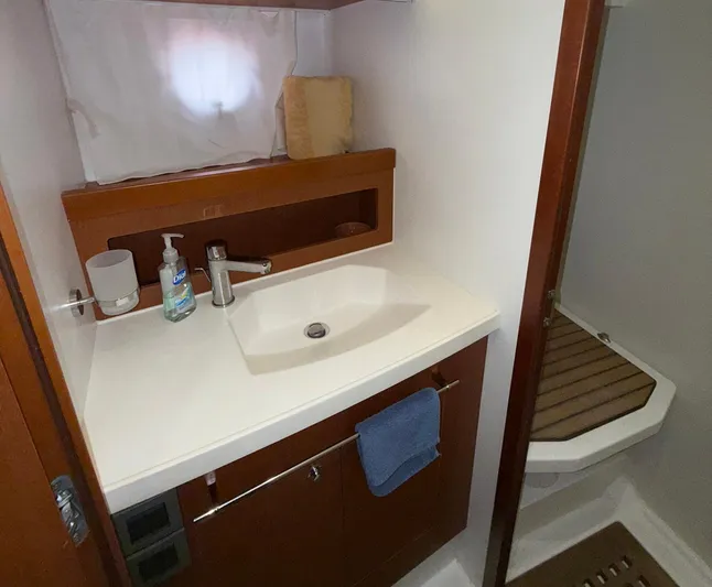 Wanderer Yacht Photos Pics 2016 Beneteau Swift Trawler 44 bathroom with sink, faucet, and shower area.