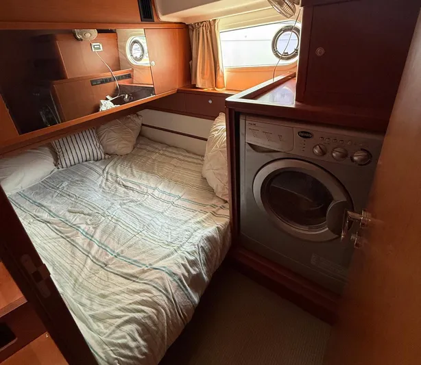 Wanderer Yacht Photos Pics Cozy cabin with bed and washer in 2016 Beneteau Swift Trawler 44.