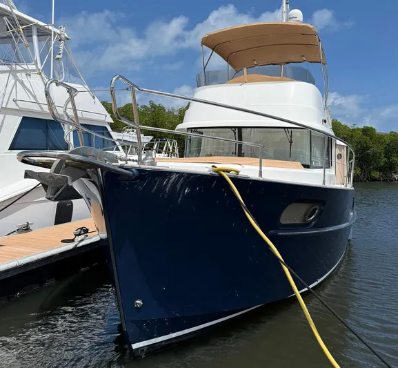 Wanderer Yacht Photos Pics 2016 Beneteau Swift Trawler 44 docked, featuring a sleek blue hull and spacious deck.